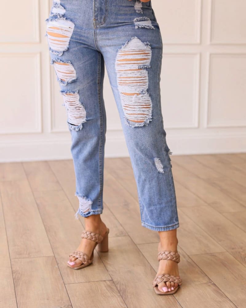 Front of a model wearing a size 10 The Savannah Mid Rise Straight Fit Distressed Denim In Medium Wash in Medium Wash by Southern Grace. | dia_product_style_image_id:356085